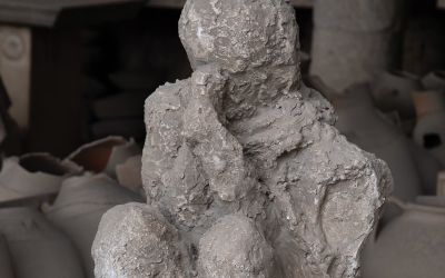 A photo of a cast made from a body found buried in Pompeii, to illustrate the article The Fate of Those Who Died in Pompeii